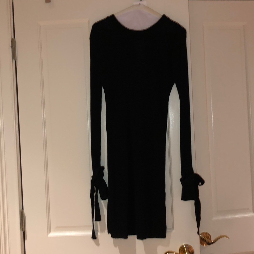 Black sweater dress with ties on sleeve